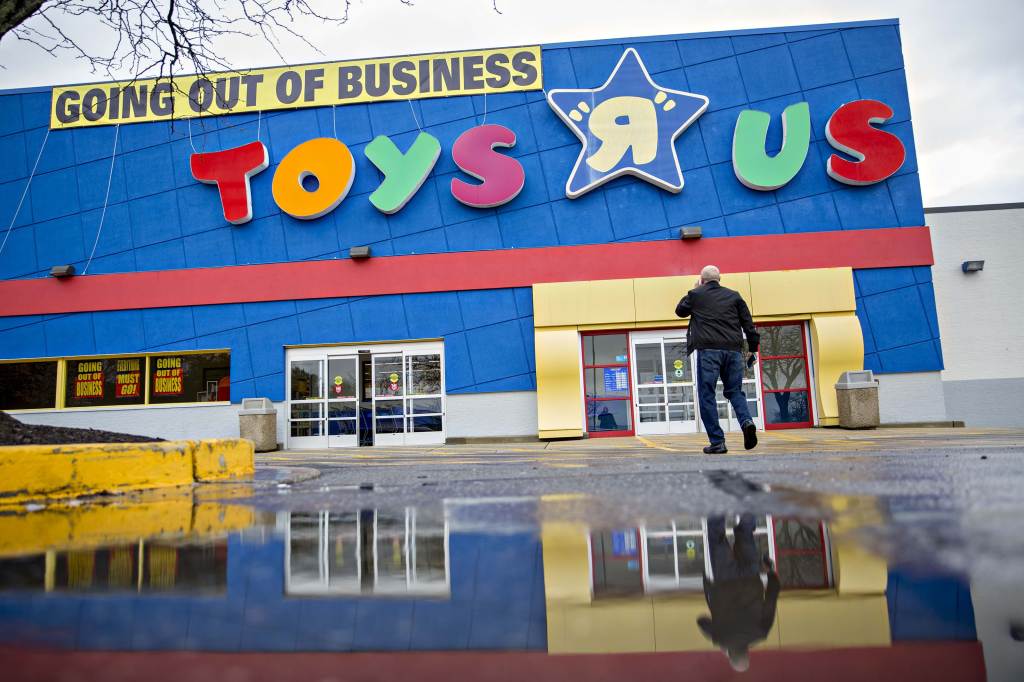 A shopper walks towards the entrance of a Toys R Us Inc. retail store in Frederick, Maryland, U.S., on Monday, April 16, 2018. Credit: Andrew Harrer/Bloomberg via Getty Images