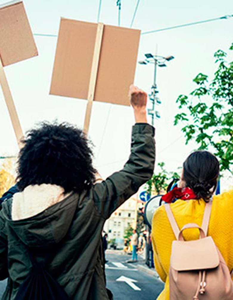 Women protesters holding up signs