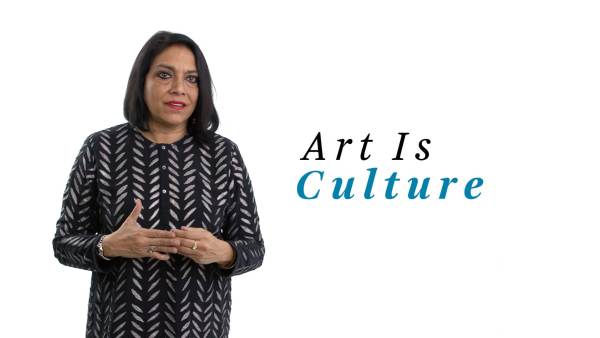 Mira Nair wears a black long-sleeved dress with a light gray feathered pattern. The phrase "Art Is Culture" appears to the right.